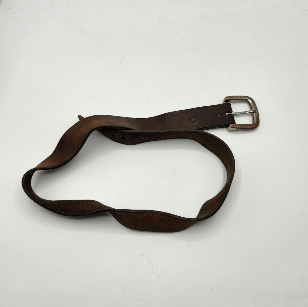 Justin brand belt with XOX Betsy buckle.